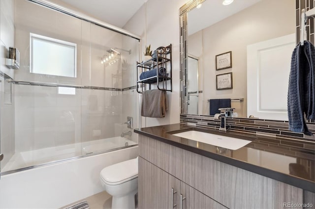 2898 W 22nd Ave, Denver, CO 80211 - bathroom with vanity, toilet, and bath / shower combo with glass door