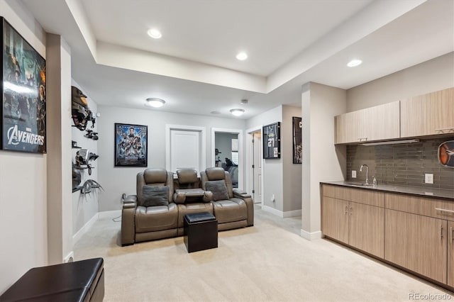 2898 W 22nd Ave, Denver, CO 80211 - cinema featuring wet bar, baseboards, light colored carpet, recessed lighting, and a tray ceiling