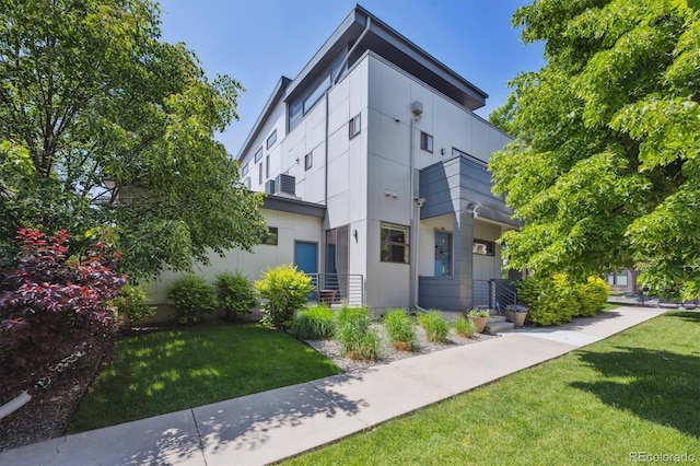 2898 W 22nd Ave, Denver, CO 80211 - rear view of property featuring a yard and stucco siding
