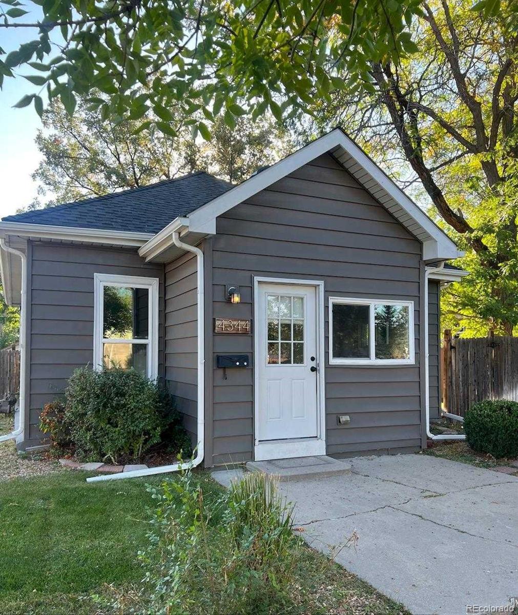 4344 Chase St, Denver, CO 80212 - view of front of home featuring roof with shingles and fence