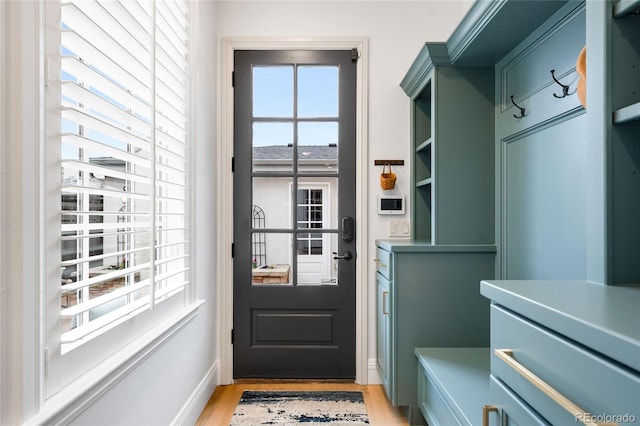 1164 S High St, Denver, CO 80210 - mudroom featuring light wood-type flooring and baseboards