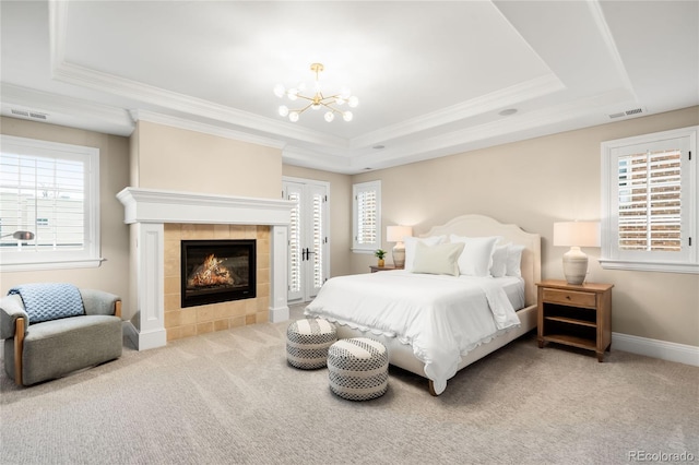 1164 S High St, Denver, CO 80210 - bedroom featuring a raised ceiling, carpet, ornamental molding, a fireplace, and a chandelier