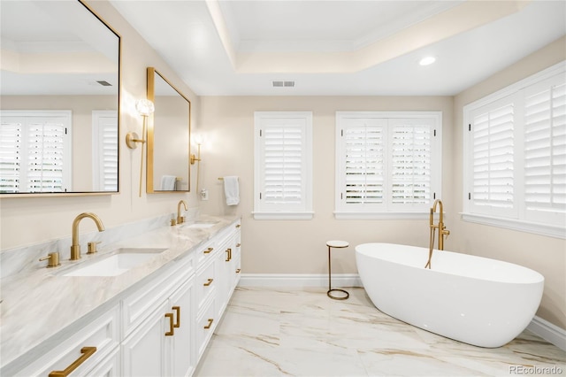 1164 S High St, Denver, CO 80210 - bathroom featuring a raised ceiling, double vanity, crown molding, marble look tiles, and a freestanding bath