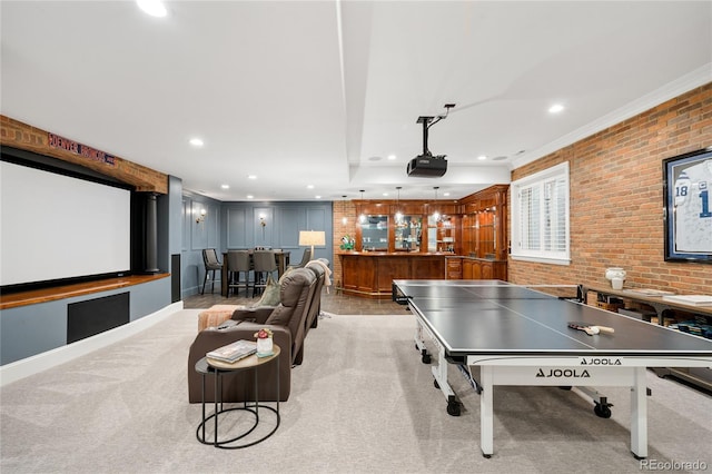 1164 S High St, Denver, CO 80210 - game room with crown molding, recessed lighting, brick wall, and light carpet