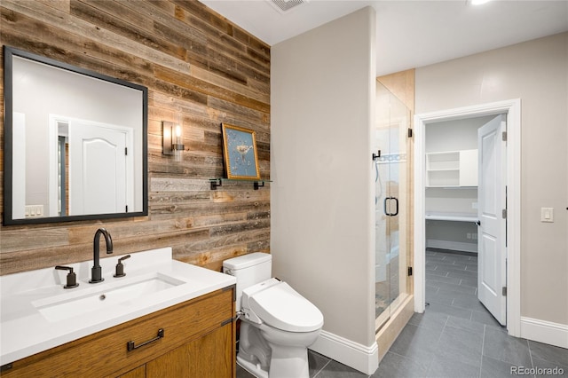 1164 S High St, Denver, CO 80210 - bathroom with wood walls, tile patterned flooring, a shower stall, vanity, and an accent wall