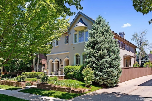 1164 S High St, Denver, CO 80210 - mediterranean / spanish-style house featuring a chimney and stucco siding