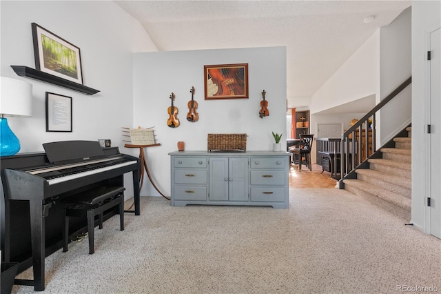 4363 E Andover Ave, Castle Rock, CO 80104 - sitting room featuring lofted ceiling, stairway, and light carpet