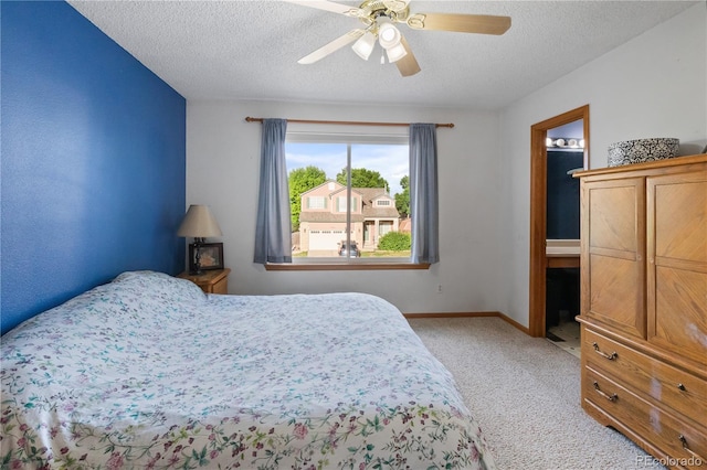 4363 E Andover Ave, Castle Rock, CO 80104 - bedroom featuring light colored carpet, a textured ceiling, and ceiling fan