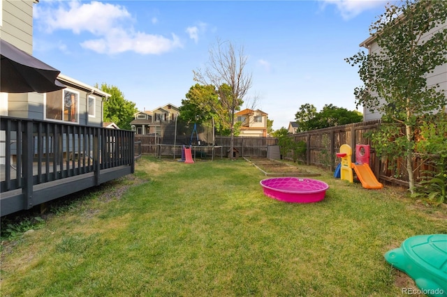 4363 E Andover Ave, Castle Rock, CO 80104 - fenced backyard featuring a trampoline, a deck, and a residential view