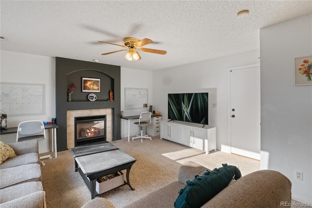 4363 E Andover Ave, Castle Rock, CO 80104 - carpeted living area featuring a ceiling fan, a fireplace, and a textured ceiling