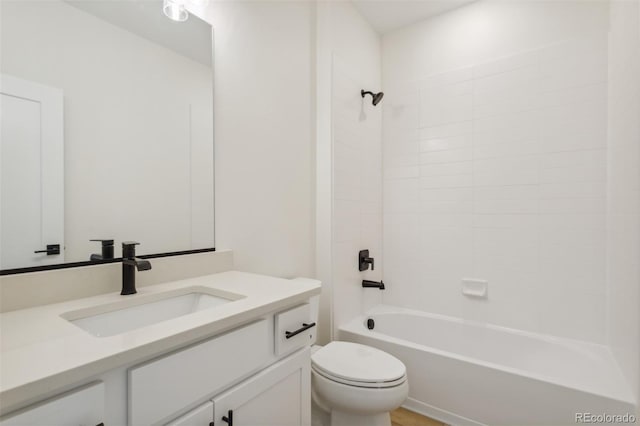 bathroom featuring shower / tub combination, toilet, and vanity