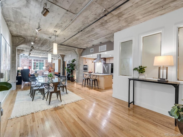 1449 Wynkoop St Unit 305, Denver, CO 80202 - dining space with light wood-style flooring