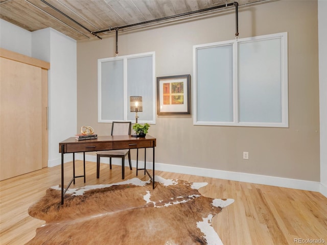 1449 Wynkoop St Unit 305, Denver, CO 80202 - office area featuring wood finished floors and baseboards