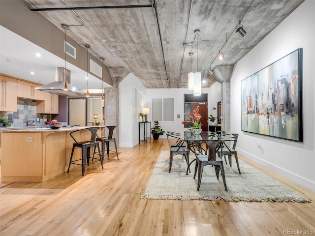 1449 Wynkoop St Unit 305, Denver, CO 80202 - dining space featuring light wood-style floors and baseboards