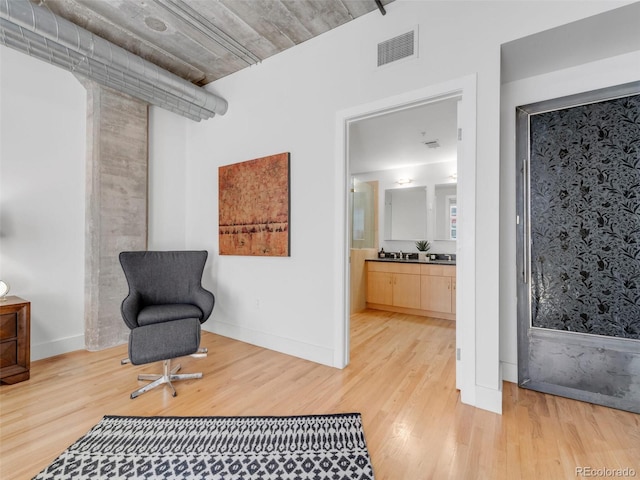 1449 Wynkoop St Unit 305, Denver, CO 80202 - living area featuring light wood-style floors and baseboards