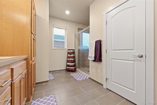 bathroom featuring tile patterned flooring and walk in shower