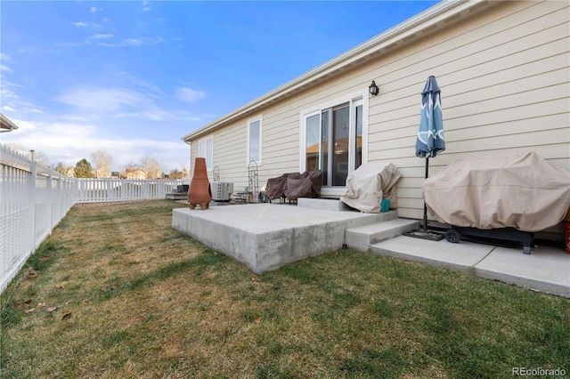 rear view of property with a patio area and a lawn