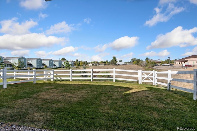 view of yard with a rural view