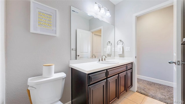 half bath featuring baseboards, visible vents, toilet, tile patterned flooring, and vanity