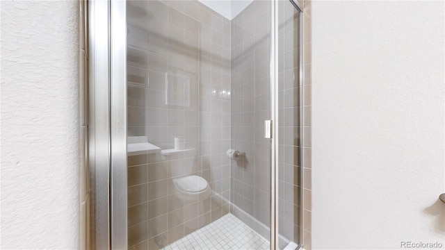 bathroom with a stall shower