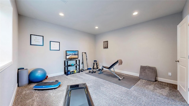 workout room with recessed lighting and baseboards