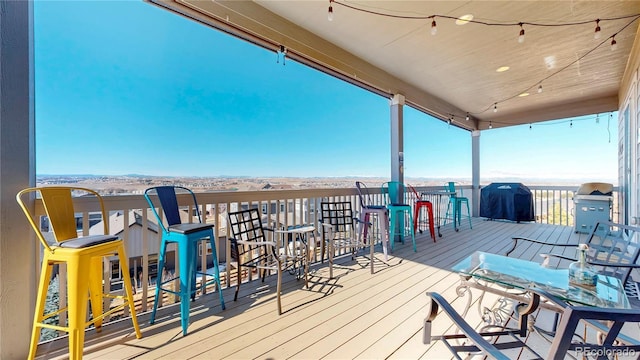 wooden terrace with grilling area