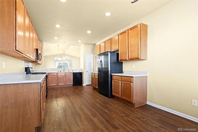 kitchen featuring lofted ceiling, dark wood-style floors, black appliances, a sink, and recessed lighting