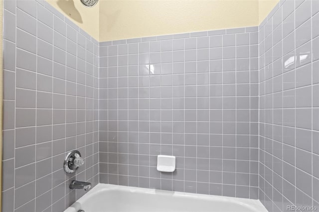 full bath featuring shower / washtub combination