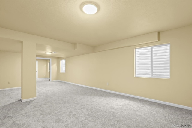 basement with carpet and baseboards