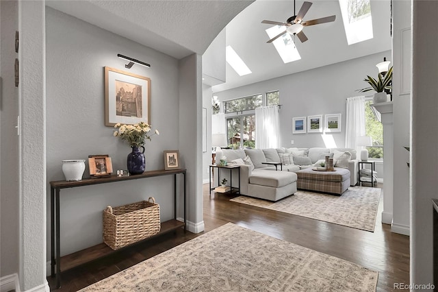 171 Columbine St, Larkspur, CO 80118 - living area featuring a skylight, healthy amount of natural light, wood finished floors, and vaulted ceiling