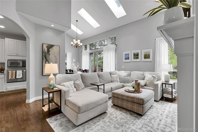 171 Columbine St, Larkspur, CO 80118 - living area featuring high vaulted ceiling, a chandelier, a skylight, dark wood-style flooring, and recessed lighting
