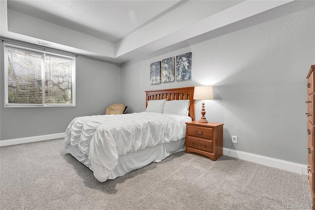 171 Columbine St, Larkspur, CO 80118 - carpeted bedroom with baseboards and a raised ceiling
