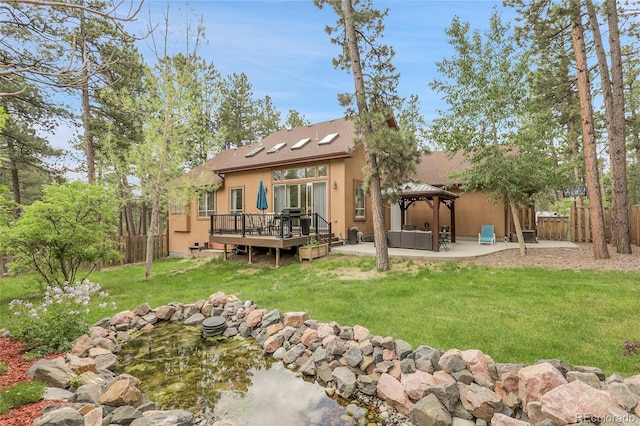 171 Columbine St, Larkspur, CO 80118 - back of house with a gazebo, a fenced backyard, stucco siding, and a patio
