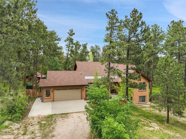 171 Columbine St, Larkspur, CO 80118 - view of front of property featuring driveway, a garage, and roof with shingles