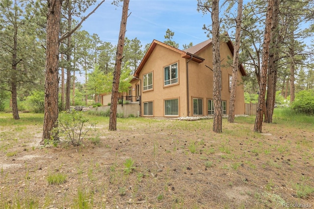 171 Columbine St, Larkspur, CO 80118 - view of property exterior with stucco siding