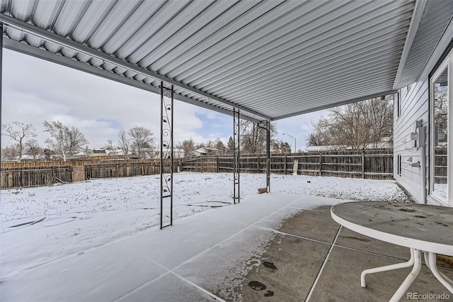 view of snow covered patio