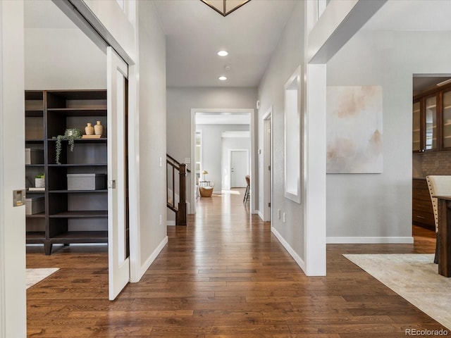 5511 Wabash St, Denver, CO 80238 - hall featuring dark wood-style floors, recessed lighting, baseboards, and stairs