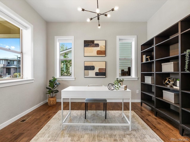 5511 Wabash St, Denver, CO 80238 - home office with a chandelier, wood finished floors, and baseboards