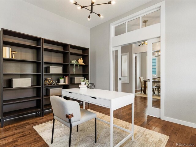 5511 Wabash St, Denver, CO 80238 - office area featuring a chandelier, dark wood-type flooring, and baseboards