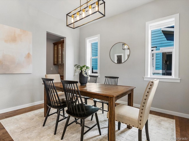 5511 Wabash St, Denver, CO 80238 - dining area with baseboards and light wood-style flooring