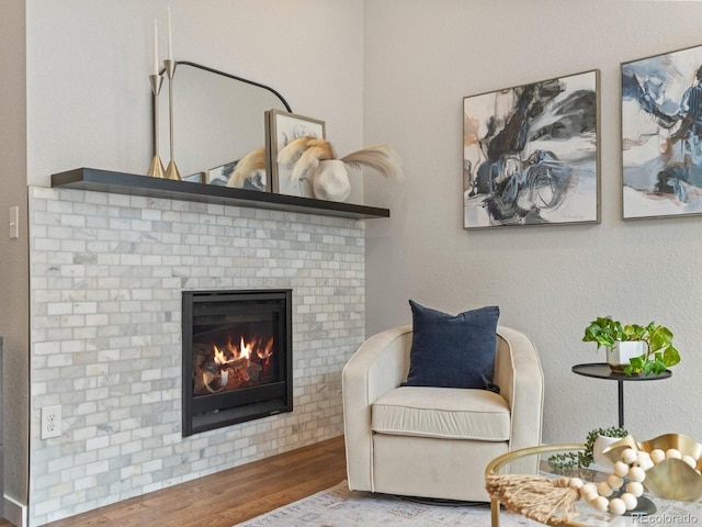 5511 Wabash St, Denver, CO 80238 - sitting room featuring wood finished floors and a fireplace