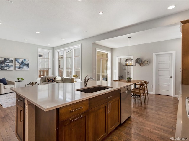 5511 Wabash St, Denver, CO 80238 - kitchen featuring a sink, stainless steel dishwasher, dark wood-style floors, open floor plan, and recessed lighting