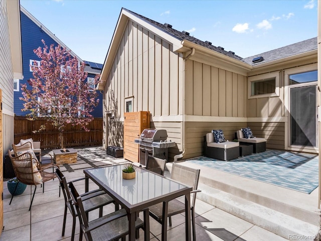 5511 Wabash St, Denver, CO 80238 - view of patio with a grill, a fenced backyard, and outdoor lounge area