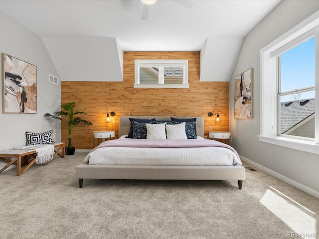 5511 Wabash St, Denver, CO 80238 - bedroom with wood walls, carpet, an accent wall, vaulted ceiling, and baseboards