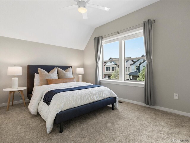 5511 Wabash St, Denver, CO 80238 - bedroom with vaulted ceiling, light colored carpet, baseboards, and a ceiling fan