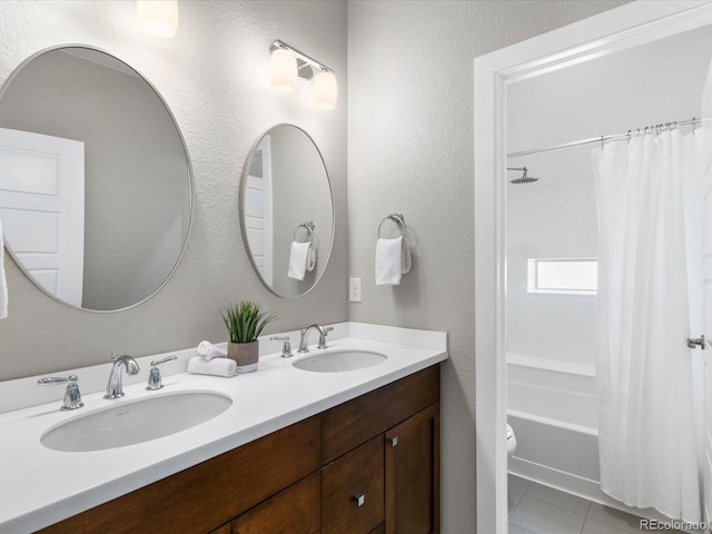 5511 Wabash St, Denver, CO 80238 - full bathroom with tile patterned floors, shower / bath combo, a textured wall, double vanity, and toilet
