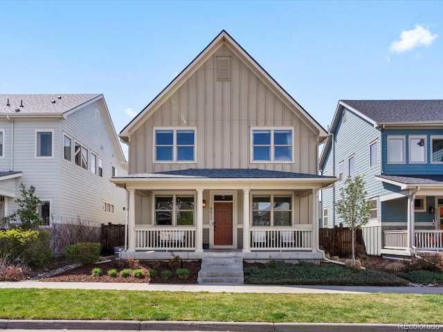 5511 Wabash St, Denver, CO 80238 - view of front of house featuring board and batten siding and covered porch
