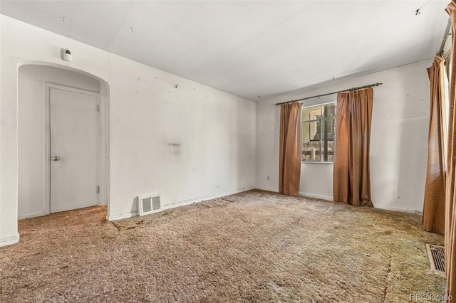 1665 S Madison St, Denver, CO 80210 - carpeted spare room with arched walkways