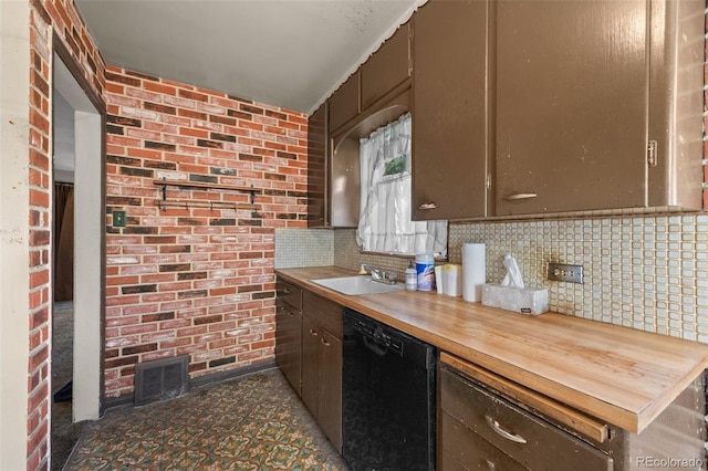 1665 S Madison St, Denver, CO 80210 - kitchen with black dishwasher, tasteful backsplash, wood counters, and brick wall