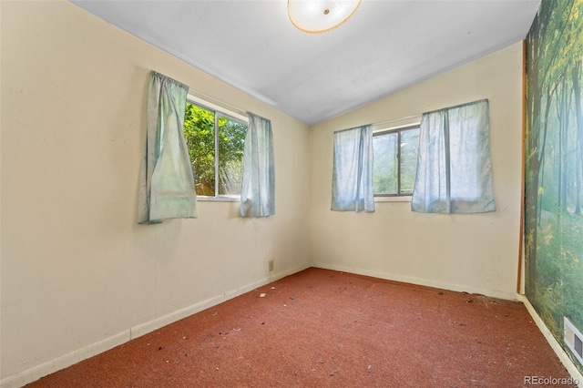 1665 S Madison St, Denver, CO 80210 - carpeted spare room featuring vaulted ceiling and baseboards